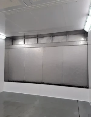 Inside a Unitech water wash spray booth with water curtain filtration
